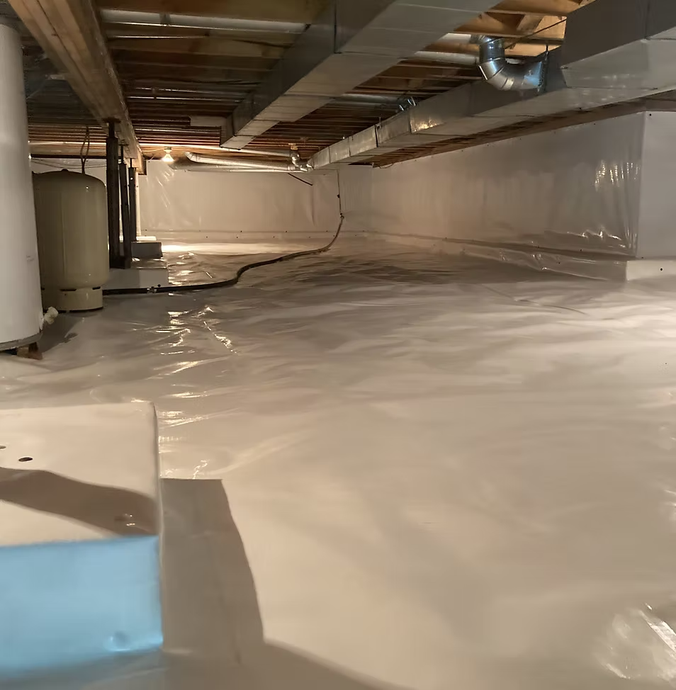 Clean crawl space with moisture barrier.